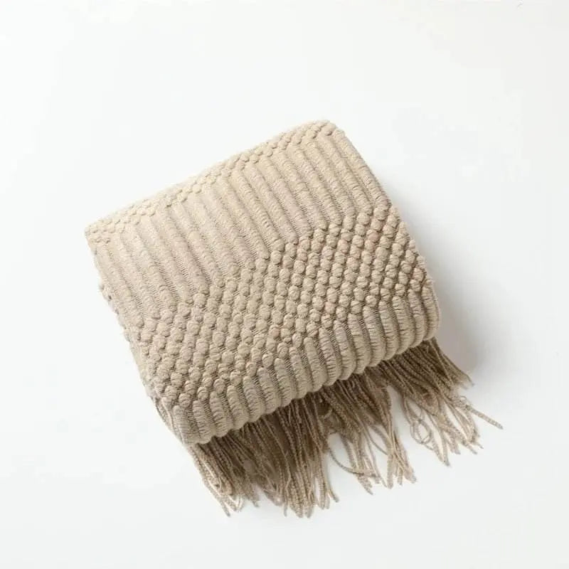 Knitted soft throw blanket with tassels, featuring stunning woven texture; available in 10 colors for cozy elegance.