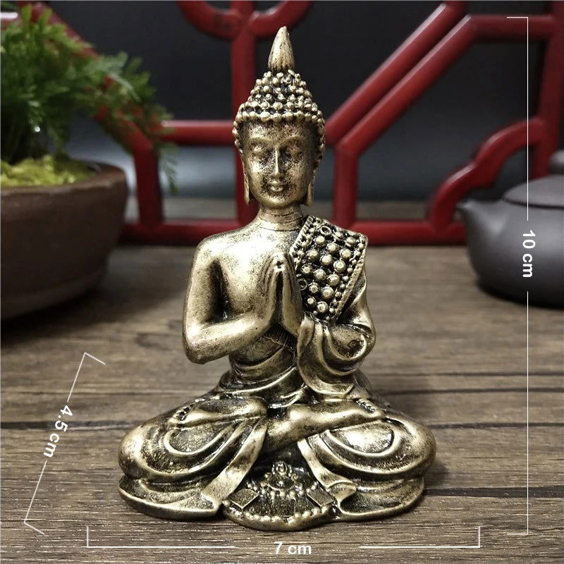 Seated Thai Buddha statue in bronze finish displaying Anjali Mudra with intricate details, measuring 10 cm in height.