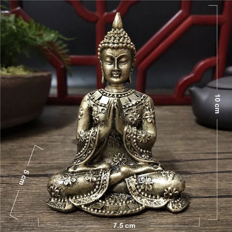 Thai Buddha statue with Anjali Mudra in gold finish, 10 cm tall, intricate details.