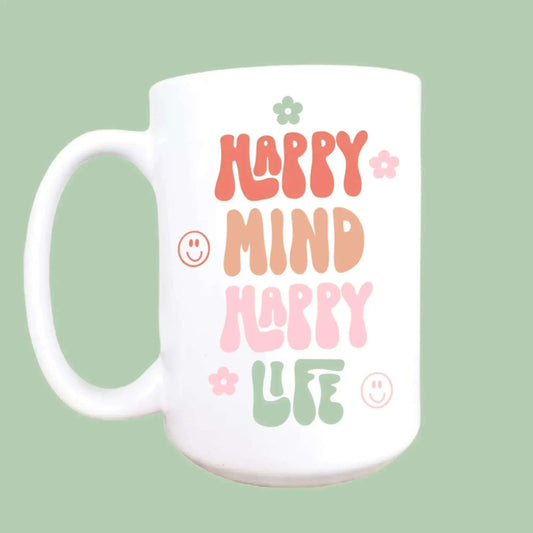 Happy mind happy life ceramic coffee mug with colorful text design.