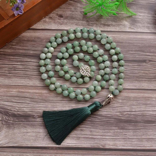 Jade Mala with 108 knotted green beads and tassel, perfect for meditation.