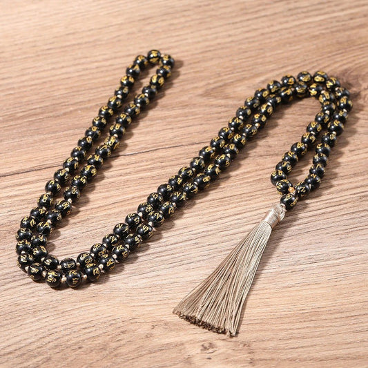 Black Onyx Mala, knotted with "Om Mani Padme Hum" Mantra engraved on each bead. - Serenity Factory