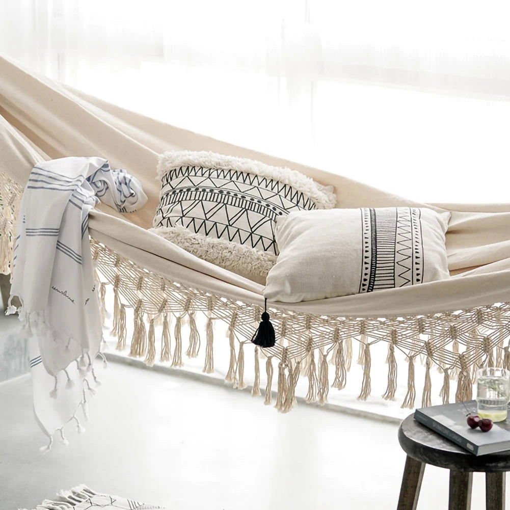 Brazilian Macramé Bohemian tassel hammock with black and white pillows, ideal for two-person comfort.