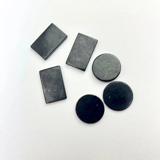 Shungite phone plates in rectangle and circle shapes for EMF protection.